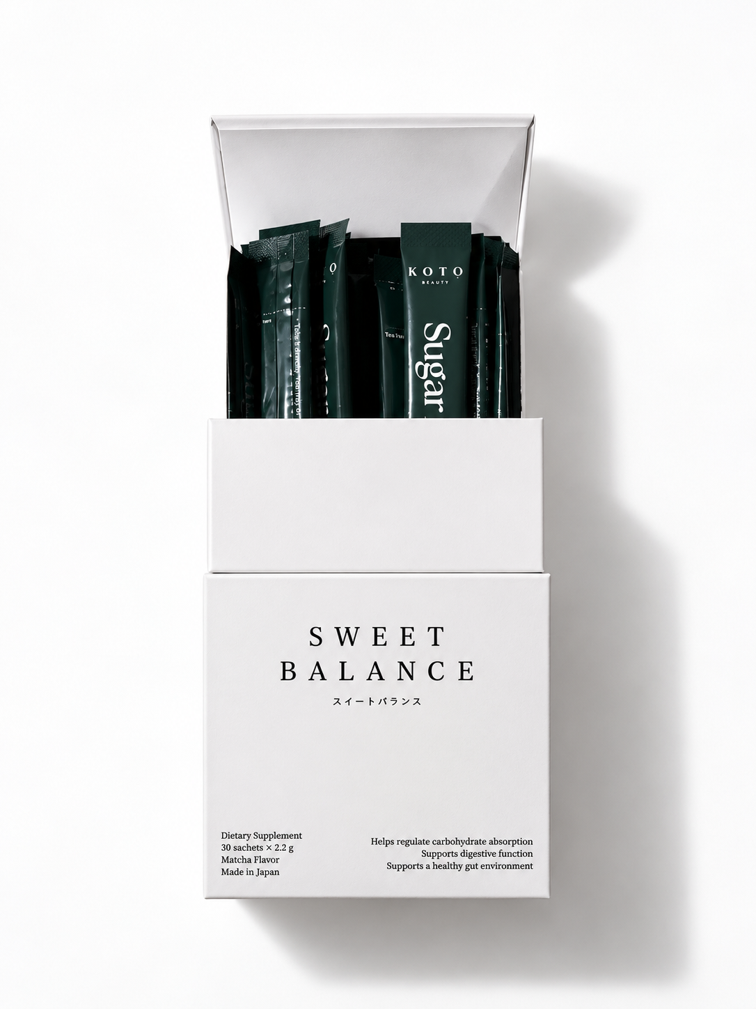 Open box of KOTO Sweet Balance showing individual matcha supplement sachets